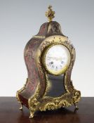 An early 20th century red boulle mantel clock, the enamelled Roman dial signed Henry Marc, Paris,