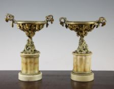 A pair of late 19th century French gilt metal and onyx tazzas, with bacchic scrolling vine leaf