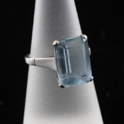 A white gold and aquamarine set ring, the emerald cut stone weighing approximately 4.00ct, size L.