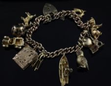 A 9ct gold curb link charm bracelet, with heart shaped padlock and hung with eleven assorted charms,