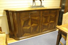 A large European walnut sideboard, fitted two frieze drawers over parquetry inlaid cupboard doors