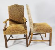 A set of fourteen beech frame dining chairs, two with arms, twelve singles, upholstered in a brass