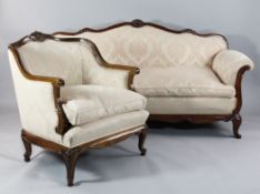 A carved mahogany six piece salon suite, scroll arm settee, pair of similar armchairs, two single