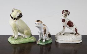 A Derby figure of a Pug dog, c.1775 and two Staffordshire porcelaneous figures of dogs, the Derby