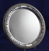 A George V silver circular salver by Elkington & Co, with pierced foliate and beaded border, on claw