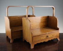 A pair of George III style satinwood book carriers, with basket handles and base drawers, on swept