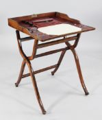A late Victorian walnut and beech folding travelling desk, opening to reveal and red leather