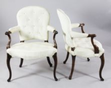 A pair of George III French Hepplewhite mahogany open armchairs, with buttonback pale watered silk