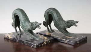A pair of French Art Deco green patinated metal models of hounds, on rectangular marble bases, 11.