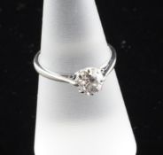 An 18ct white gold solitaire diamond ring, the round cut stone weighing approximately in excess of