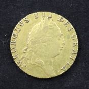 A George III 1792 gold spade guinea.