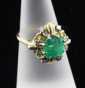 An 18ct gold, emerald and diamond cluster ring, size K.