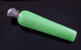 A late Victorian repousse silver mounted opaque green glass scent bottle, of tapering cylindrical