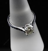 An 18ct white gold solitaire diamond ring, the round brilliant cut stone weighing approximately 0.