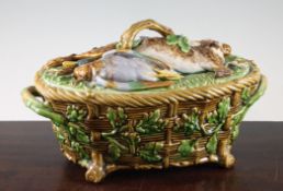 A Minton majolica game pie dish, liner and cover, c.1880, the body modelled as a basket entwined