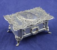 An Edwardian silver trinket box by Goldsmiths & Silversmiths Co Ltd, of shaped rectangular form, the
