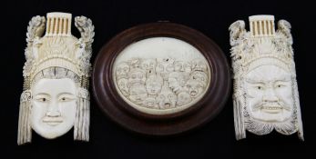 Two Chinese ivory masks and an ivory plaque, early 20th century, the mask carved as an emperor and