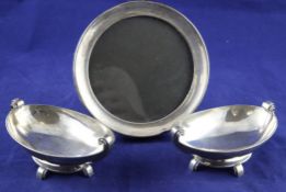 A stylish pair of George VI Art Deco silver boat shaped nut dishes, wIth stepped scroll handles,