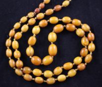 A single strand graduated oval amber bead necklace, gross weight, 42 grams, 34in.