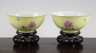 A pair of Chinese famille rose yellow ground bowls, Jiaqing seal marks, but early 20th century, each