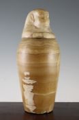 An ancient Egyptian alabaster canopic jar and cover, 16th-4th century BC, the jar with a flat