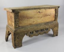 An 18th / 19th century European cedar cassone or coffer, with chip carved borders and bracket feet