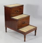 A set of early 19th century mahogany bed steps, with hinged top, slide out drawer and ring turned