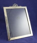 An Edwardian silver ribbon top photograph frame, of plain rectangular form, Mappin & Webb, London,