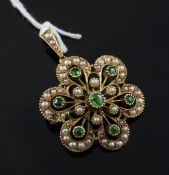 A Victorian 15ct gold, demantoid garnet and seed pearl set flowerhead pendant brooch, 1in.