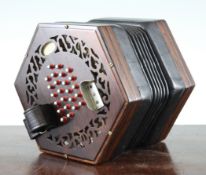 A 19th century Charles Wheatstone & Co. forty eight key hexagonal concertina, with fret pierced