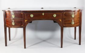 An early 19th century mahogany and boxwood inlaid breakfront sideboard, with central frieze drawer