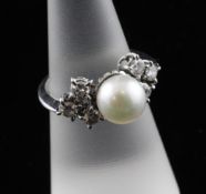 An 18ct white gold, cultured pearl and diamond cluster ring, size M.