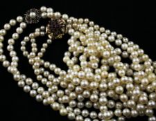 A double strand Mikimoto cultured pearl necklace with 9ct white gold gem set clasp , 35in and a