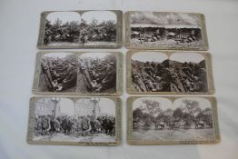 A collection of stereoscopic viewing cards of the Great War, housed in two cases, each case modelled