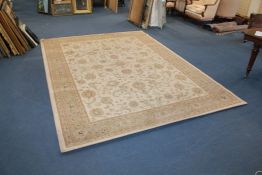 A Belgian Persian style carpet, with field of scrolling foliage on an ivory ground, with multi row