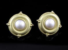 A pair of 18ct gold and mabe pearl target earrings, with rope twist and berry border.