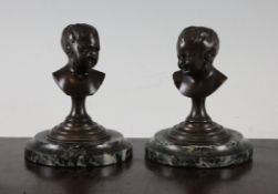After Jean Antoine Houdon. A pair of late 19th century French bronze busts of children, one