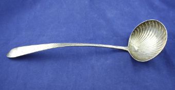 A George III Irish silver Celtic tip soup ladle, with bright cut engraved handle with initials and