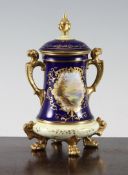 A Coalport tapering cylindrical vase and cover, c.1910, painted to a gilt outlined reserve with a