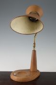 Attributed to Jacques Adnet (1901-1984). A stylish 1950`s desk lamp, in brown leather with