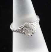 An early 20th century platinum and solitaire diamond ring, the cushion cut diamond weighing