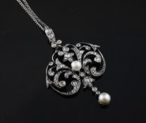 A gold and silver, diamond and cultured pearl set drop pendant necklace, of scrolling openwork