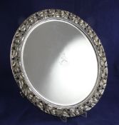 A Victorian silver salver, of circular form, with engraved armorial and applied pierced leaf and