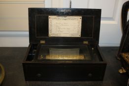 A 19th century Swiss rosewood music box, with rectangular boxwood inlaid case, playing six airs