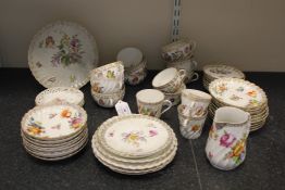 A Dresden fifty-one piece part tea set, early 20th century, each piece typically painted with flower