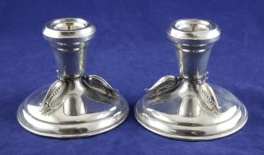 A stylish pair of mid 20th century Canadian sterling silver dwarf candlesticks by Carl Poul