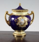 A Coalport porcelain twin handled globular vase and cover, c.1900, painted to each side with