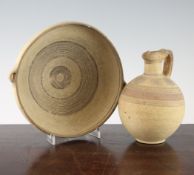 An ancient Cypriot pottery bowl and a similar jug, 1000-600BC, typically decorated with concentric