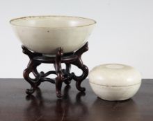 A Chinese Ding ware bowl and a similar box and cover, Song-Jin dynasty, the bowl with proud ring