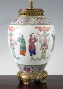 A Chinese famille rose ovoid vase, 20th century, mounted as a lamp, painted with a procession of